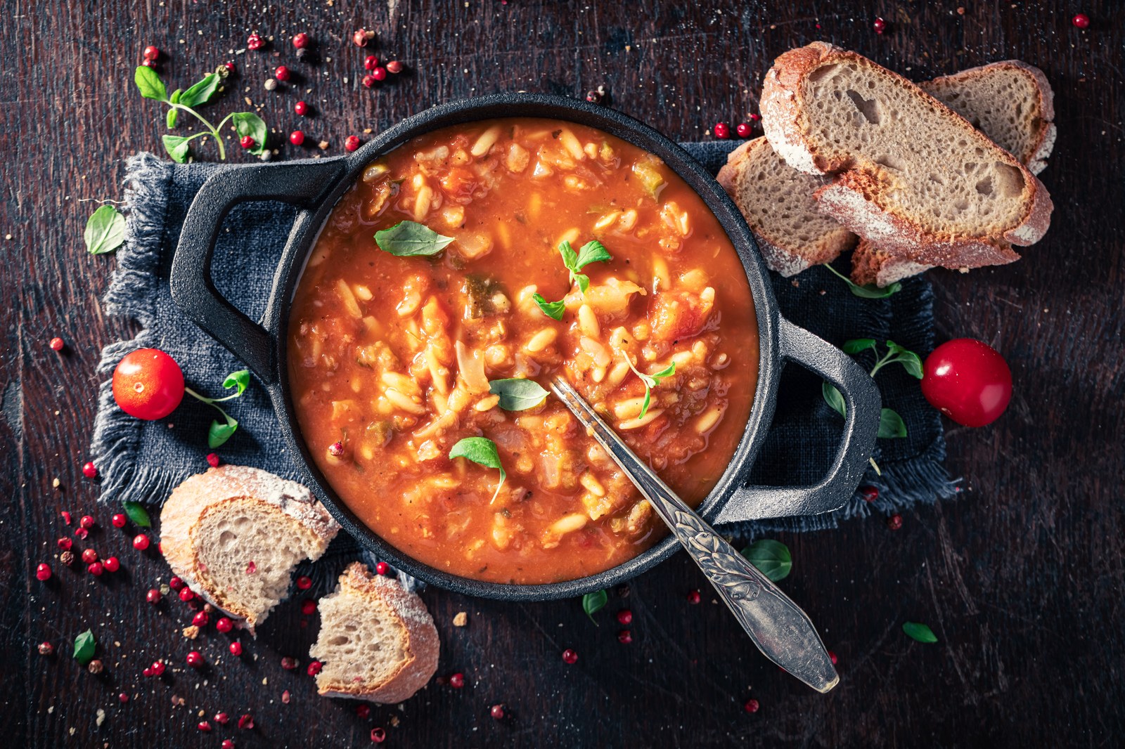 Rustic Italian vegetable soup with white beans and pasta in tomato broth