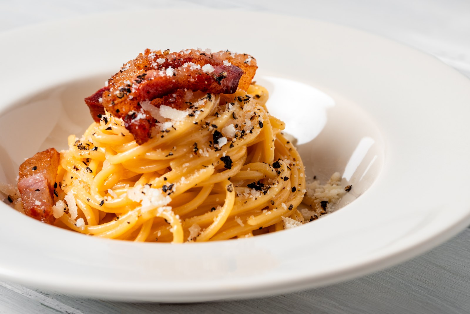 Spaghetti with crispy guanciale, pecorino cheese, and black pepper